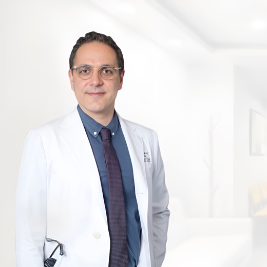 Dr. Michael Ghalchi in a white coat